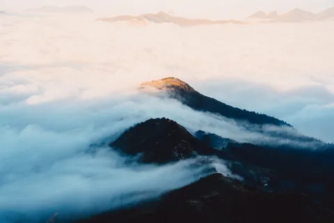 Mountain island over a sea of clouds